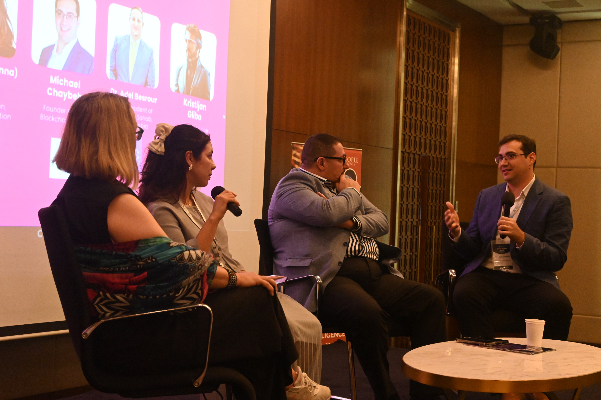 Conference panel discussion featuring blockchain industry speakers